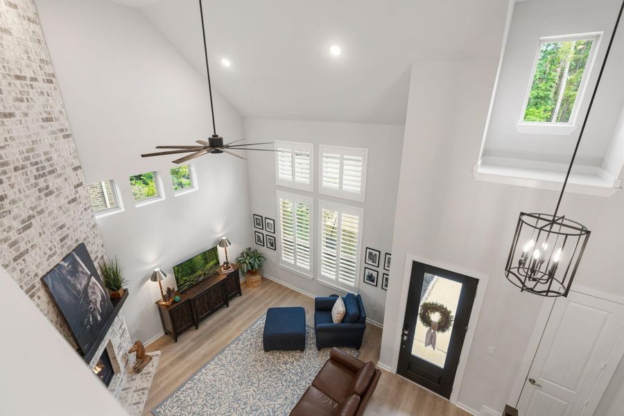 High ceilings offer an open feeling - abundance of windows brings in natural light and views of the green space