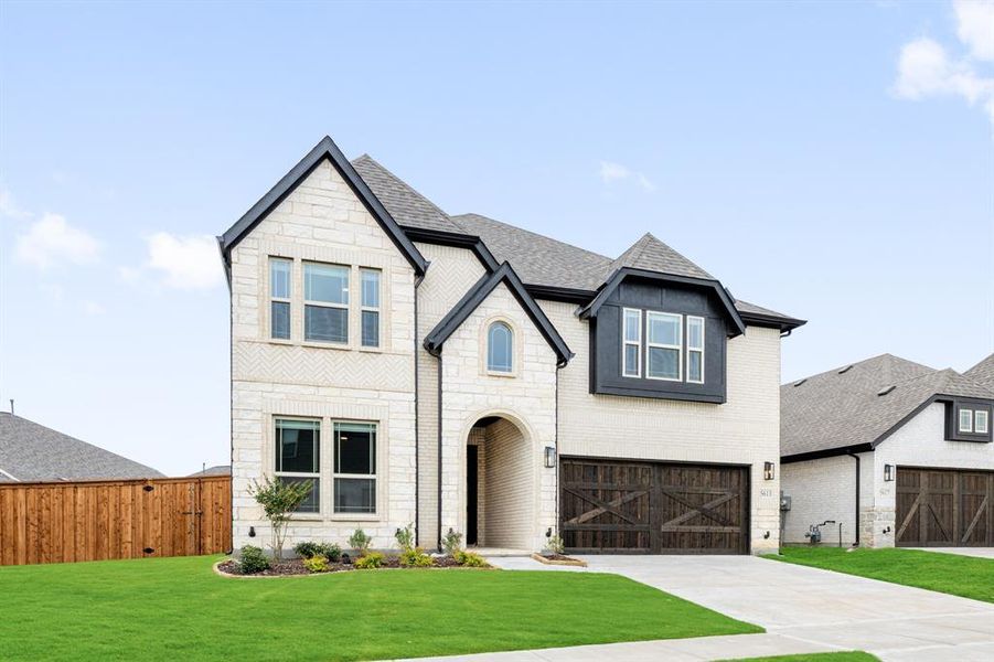 Front exterior of a new home in Willow Wood, McKinney, TX, highlighting curb appeal (Image 27). Front exterior of a new home in Willow Wood, McKinney, TX, highlighting curb appeal (Image 27).
