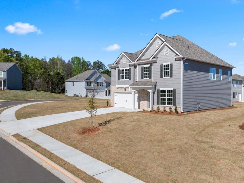 Front exterior of a new home in Thompson Ridge, Dallas, GA, highlighting curb appeal (Image 17).