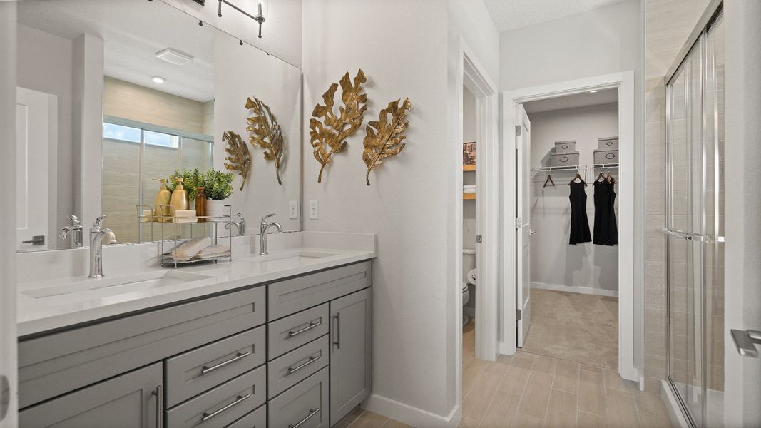 Contemporary Primary En Suite Bath with in this New Construction Home in Winter Haven by DRB Homes in Willowbrook North