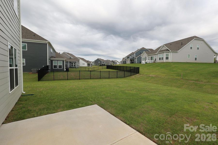 Exterior details and patio area of a home in Estates at Sugar Creek, Indian Land (Image 26).