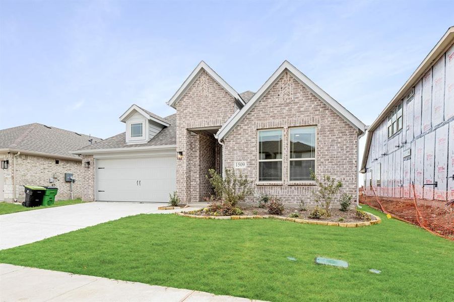 Front exterior of a new home in ArrowBrooke, Aubrey, TX, highlighting curb appeal (Image 25).