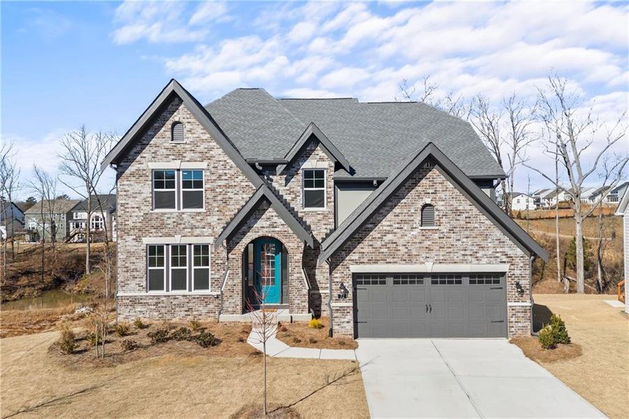 Front exterior of a new home in , Hoschton, GA, highlighting curb appeal (Image 1).