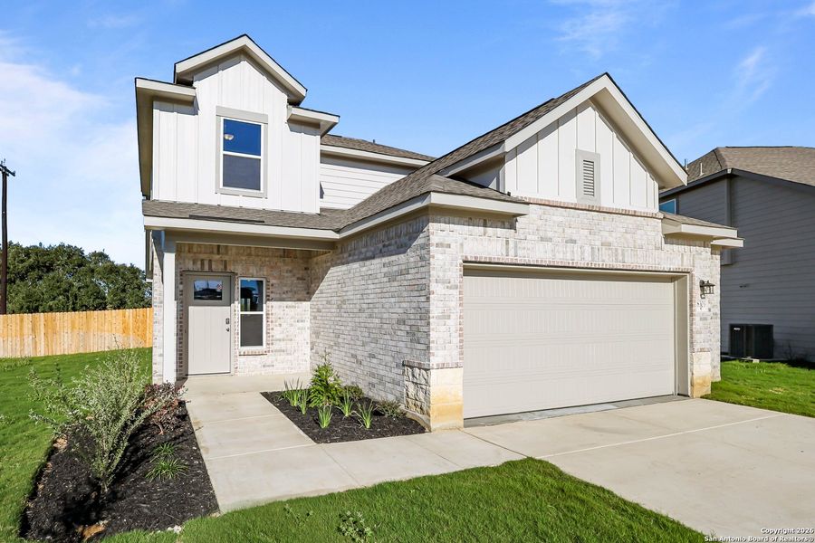 Front exterior of a new home in Garden Grove, Schertz, TX, highlighting curb appeal (Image 19).