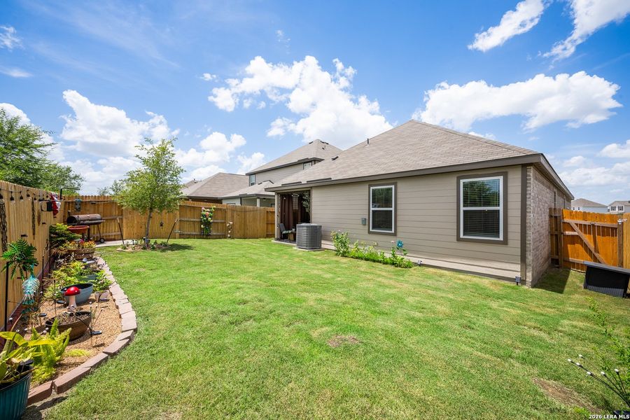 Exterior details and patio area of a home in Hightop Ridge, Converse (Image 21).