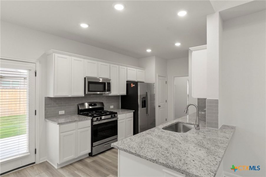 Furnished interior view inside a new home in Crosswinds, Kyle (Image 10).