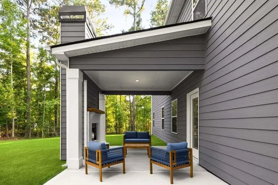 Exterior details and patio area of a home in The Woodlands Preserve, Jackson (Image 3).