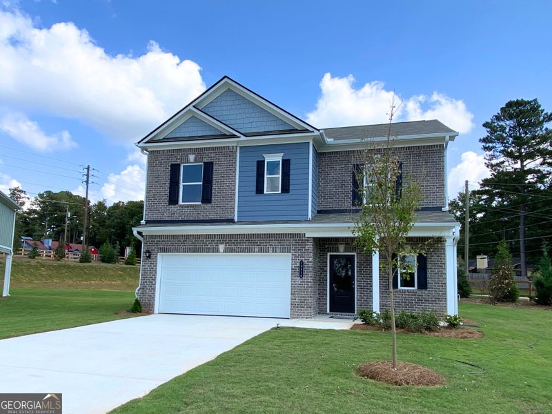 Front exterior of a new home in Trellis Park, Hampton, GA, highlighting curb appeal (Image 1).