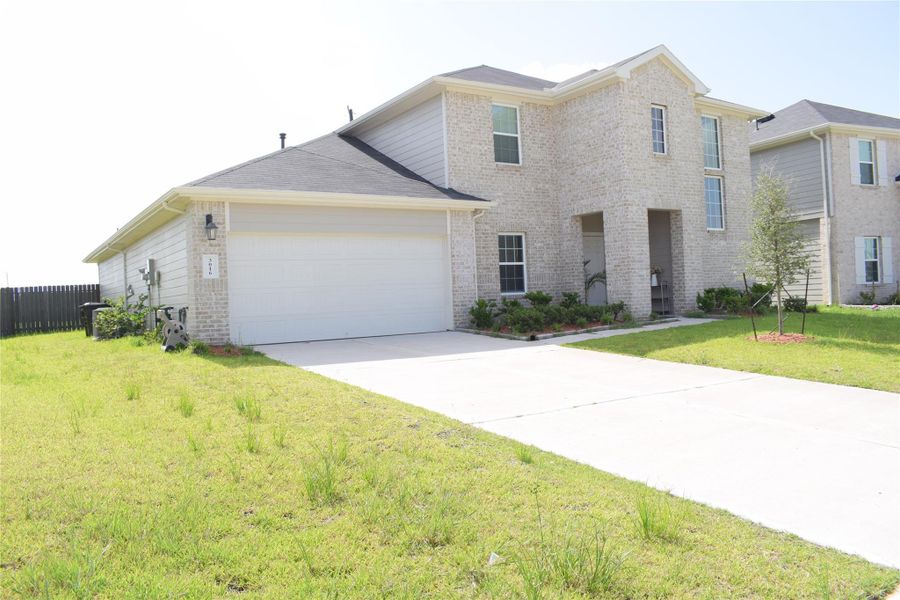 Front exterior of a new home in Bryan Grove, Rosenberg, TX, highlighting curb appeal (Image 27). Front exterior of a new home in Bryan Grove, Rosenberg, TX, highlighting curb appeal (Image 27).