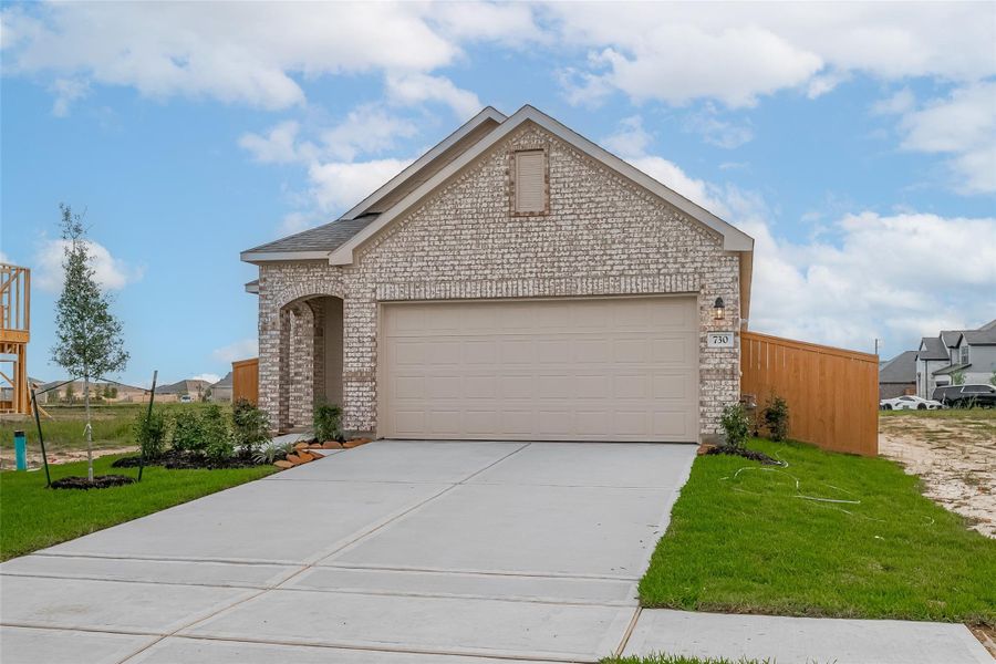 Front exterior of a new home in Enclave at Willis, Willis, TX, highlighting curb appeal (Image 1). Front exterior of a new home in Enclave at Willis, Willis, TX, highlighting curb appeal (Image 1).