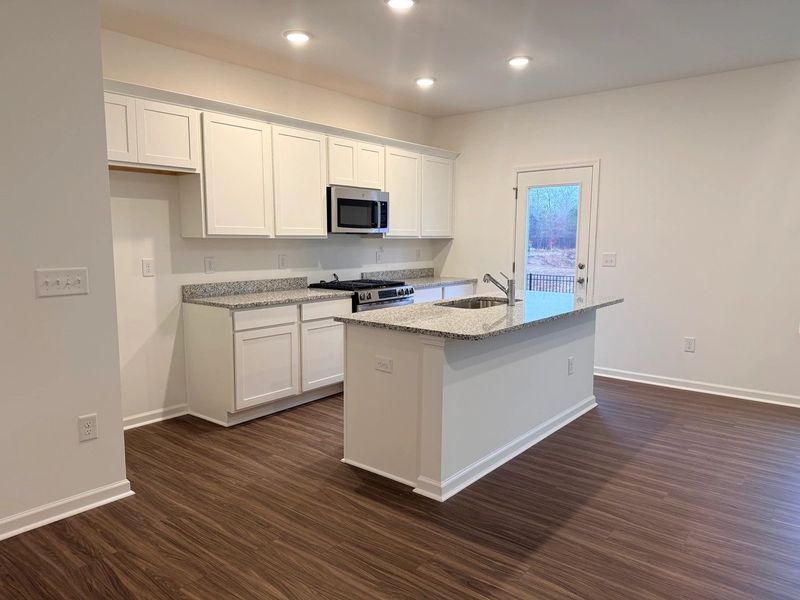Kitchen - Chic white finishes and smooth surfaces shine. Kitchen - Chic white finishes and smooth surfaces shine.