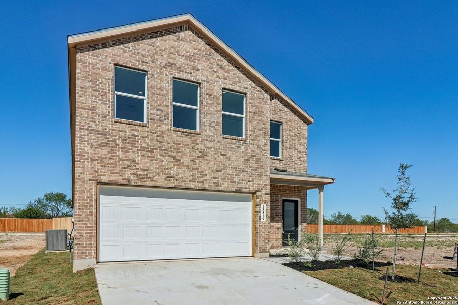 Front exterior of a new home in Summerlin: Eventide Collection, San Antonio, TX, highlighting curb appeal (Image 25).
