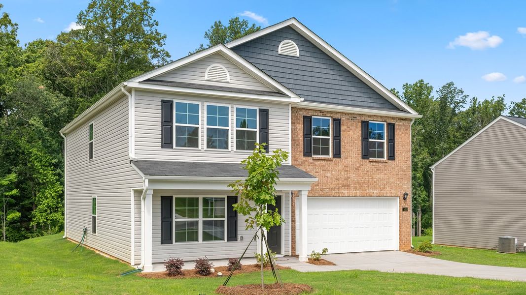 Front exterior of a new home in Edinborough, Gibsonville, NC, highlighting curb appeal (Image 2). Front exterior of a new home in Edinborough, Gibsonville, NC, highlighting curb appeal (Image 2).