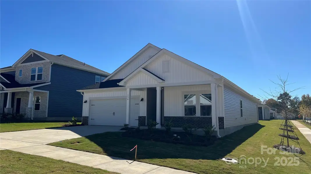 Front exterior of a new home in Oxford Station, Salisbury, NC, highlighting curb appeal (Image 1).