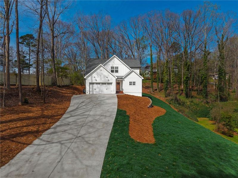 Front exterior of a new home in , Woodstock, GA, highlighting curb appeal (Image 21).