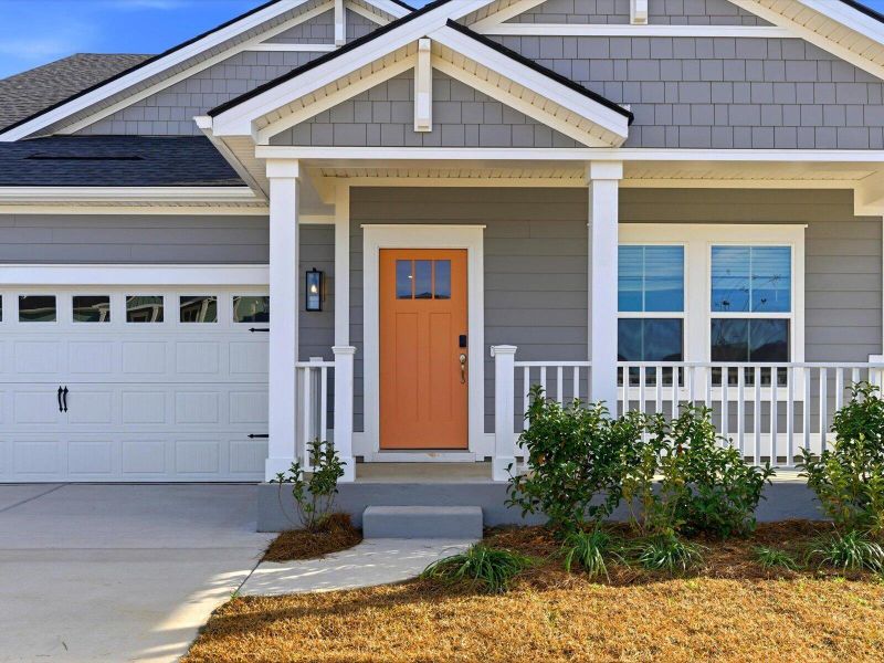 Exterior details and patio area of a home in The Coves at Lakes of Cane Bay, Summerville (Image 29).