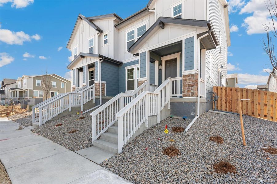 Exterior details and patio area of a home in Turnberry, Commerce City (Image 24).