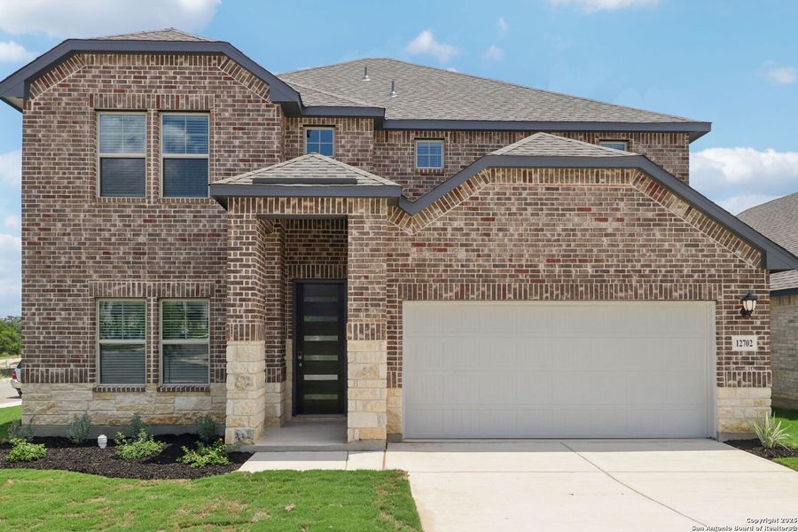 Front exterior of a new home in Arcadia Ridge - Classic Series, San Antonio, TX, highlighting curb appeal (Image 2).