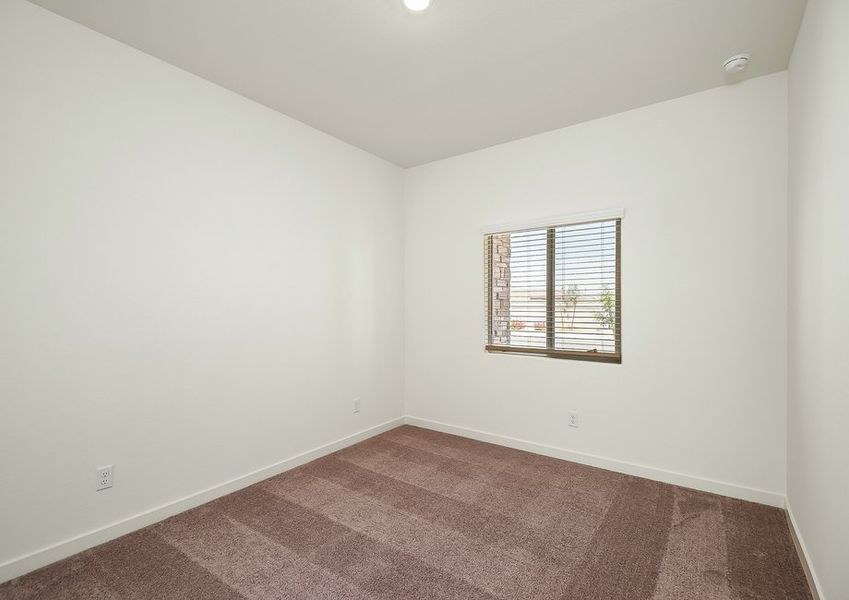 First-floor bedroom with window and carpet in Wellton floor plan