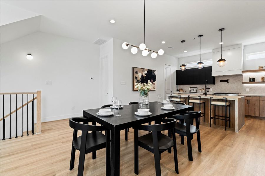 Another angle of the dining room, offering a glimpse of the discreetly tucked-away powder bath and pantry. Another angle of the dining room, offering a glimpse of the discreetly tucked-away powder bath and pantry.