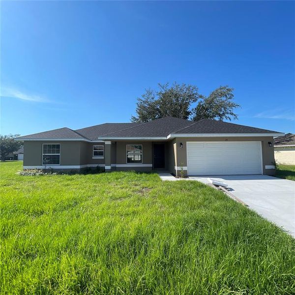 Exterior details and patio area of a home in Poinciana-Osceola County, Kissimmee (Image 2).