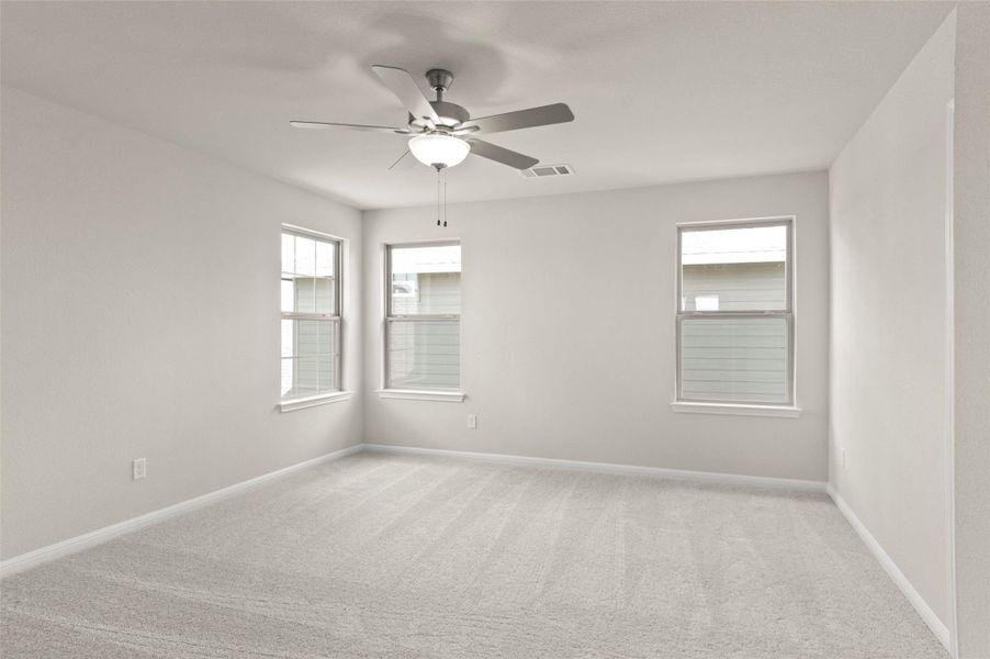 Unfurnished room featuring light carpet and ceiling fan