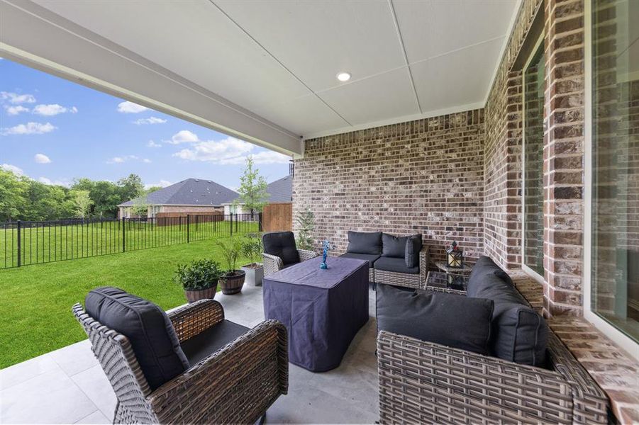 Exterior details and patio area of a home in Valencia On The Lake, Little Elm (Image 26). Exterior details and patio area of a home in Valencia On The Lake, Little Elm (Image 26).