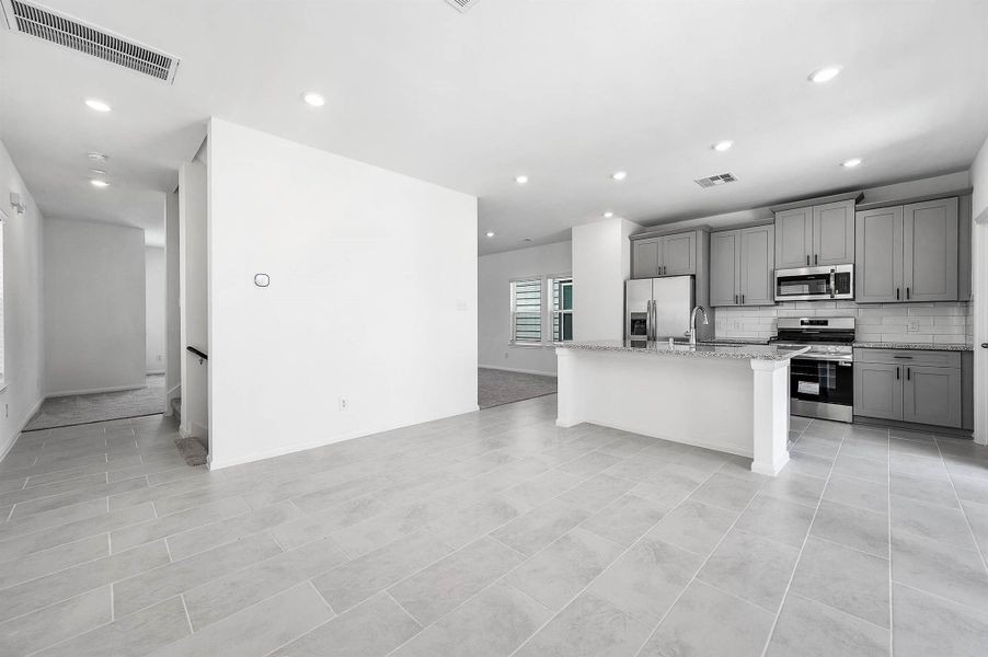 View of the formal dining and kitchen. View of the formal dining and kitchen.