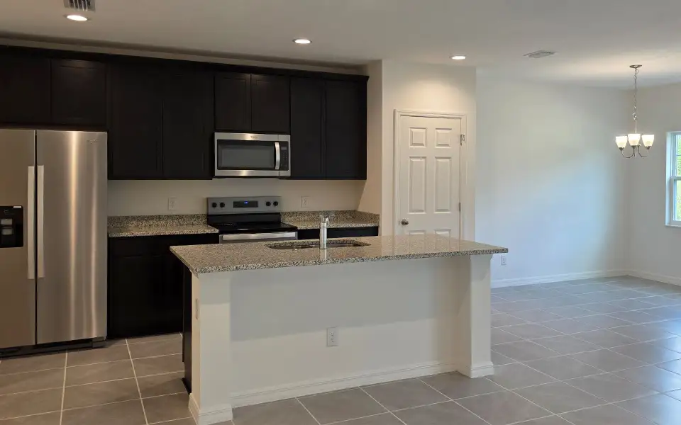 Furnished interior view inside a new home in Blue Springs Reserve Townhomes, Groveland (Image 4). Furnished interior view inside a new home in Blue Springs Reserve Townhomes, Groveland (Image 4).