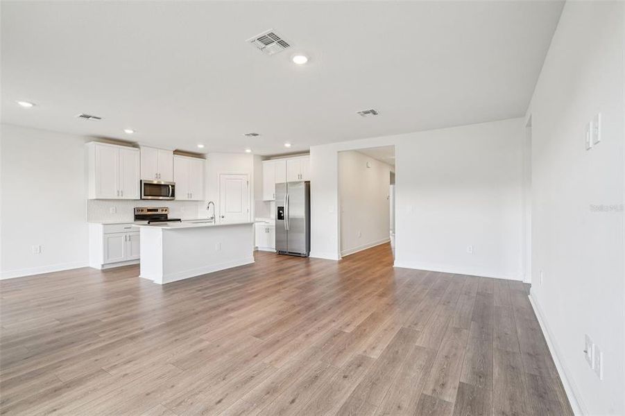 Spacious, unfurnished interior of a new home in The Reserve at Hammock Oaks - Signature Series, Lady Lake (Image 14).