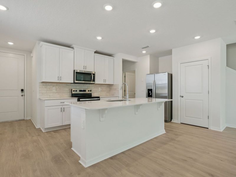 Furnished interior view inside a new home in Bradford Park, Ormond Beach (Image 4).