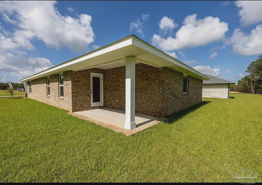 Front exterior of a new home in Hidden Pines, Milton, FL, highlighting curb appeal (Image 13).
