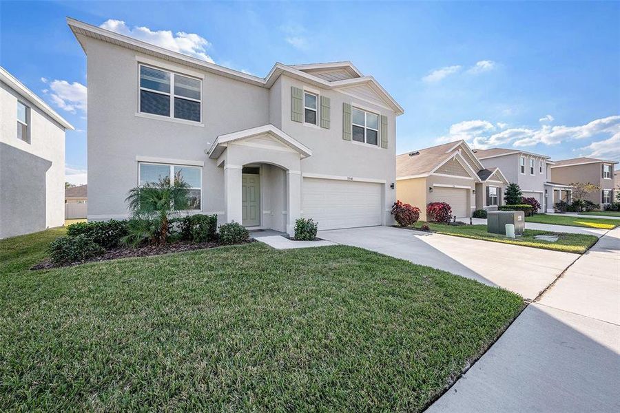 Front exterior of a new home in , Wesley Chapel, FL, highlighting curb appeal (Image 2).