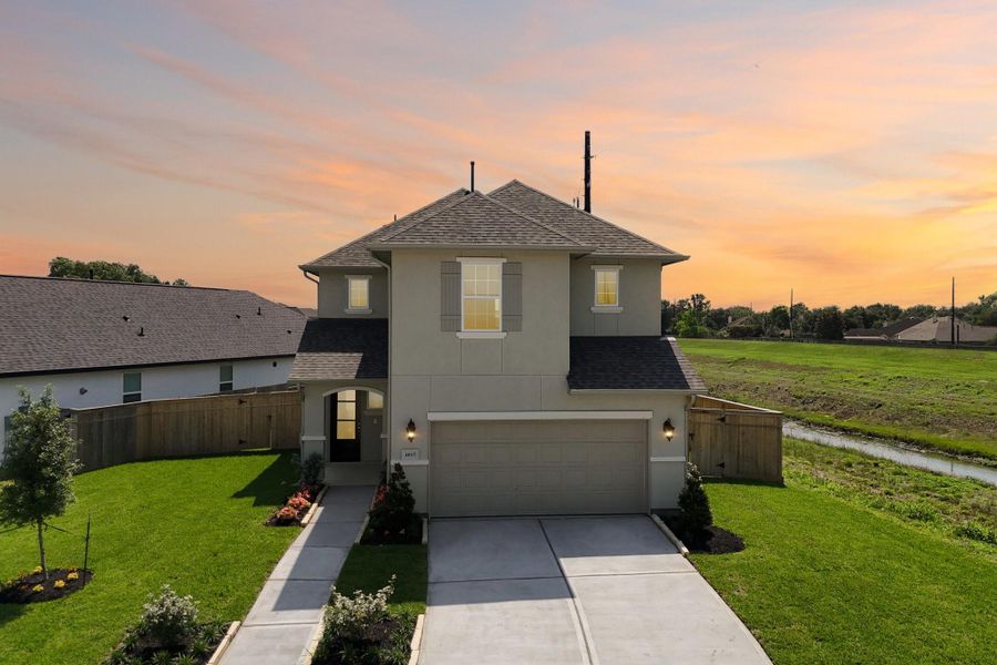 Front exterior of a new home in Sienna 40', Missouri City, TX, highlighting curb appeal (Image 1). Front exterior of a new home in Sienna 40', Missouri City, TX, highlighting curb appeal (Image 1).