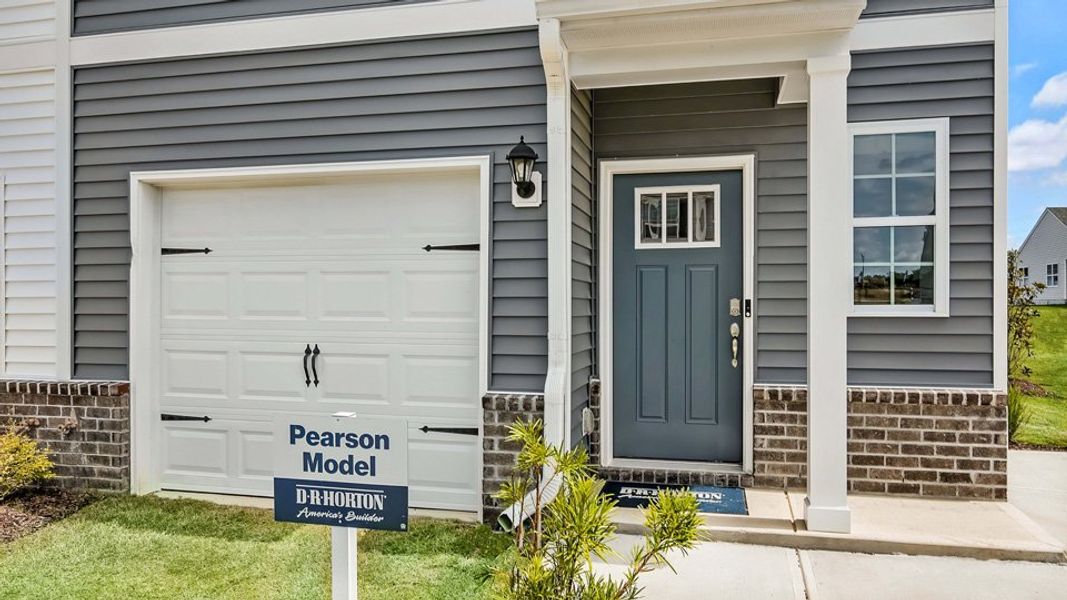 Representative exterior photo of a completed home built from the PEARSON by D.R. Horton in The Townes at Prestleigh, Wake Forest, NC (Image 20).