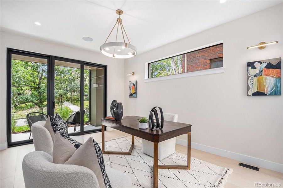 Main floor study w/ closet & access to 2 patios