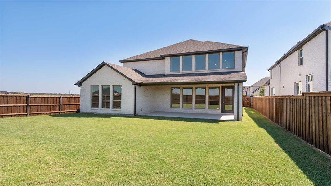 Front exterior of a new home in Mosaic 50', Celina, TX, highlighting curb appeal (Image 2).