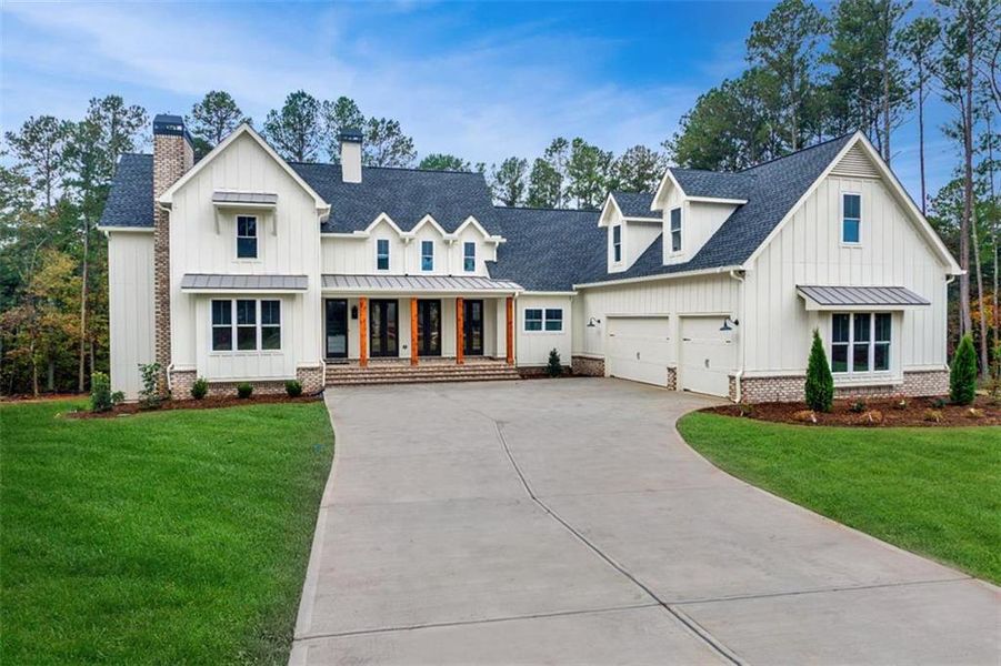 Front exterior of a new home in , Woodstock, GA, highlighting curb appeal (Image 27).