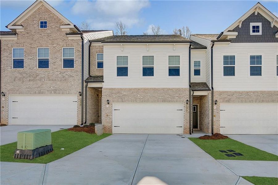 Front exterior of a new home in Auburn Ridge, Riverdale, GA, highlighting curb appeal (Image 15). Front exterior of a new home in Auburn Ridge, Riverdale, GA, highlighting curb appeal (Image 15).