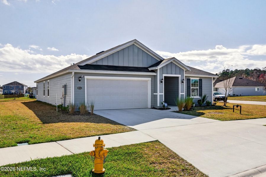 Front exterior of a new home in , Jacksonville, FL, highlighting curb appeal (Image 26).
