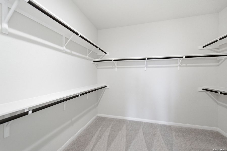 Spacious, unfurnished interior of a new home in The Woodlands at Medina Hills, Mico (Image 31).