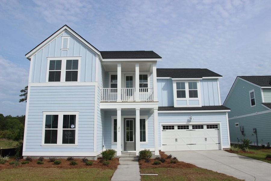 Front exterior of a new home in Carnes Crossroads, Summerville, SC, highlighting curb appeal (Image 1). Front exterior of a new home in Carnes Crossroads, Summerville, SC, highlighting curb appeal (Image 1).