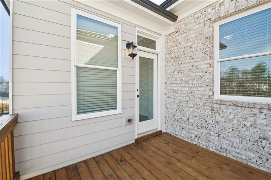Exterior details and patio area of a home in Ward's Crossing Townhomes, Johns Creek (Image 29).