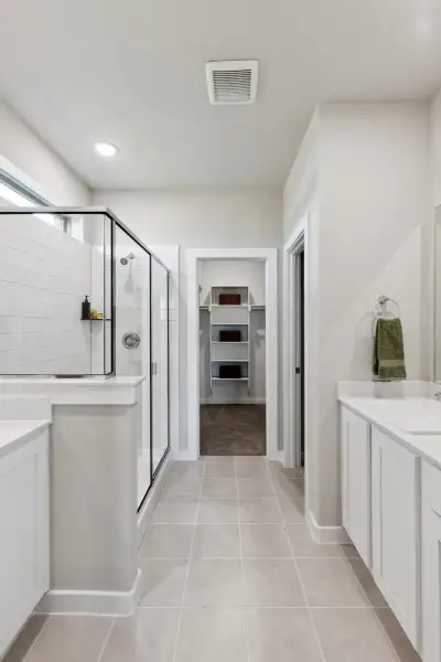 Primary Bathroom in the Magnolia home plan by Trophy Signature Homes – REPRESENTATIVE PHOTO Primary Bathroom in the Magnolia home plan by Trophy Signature Homes – REPRESENTATIVE PHOTO