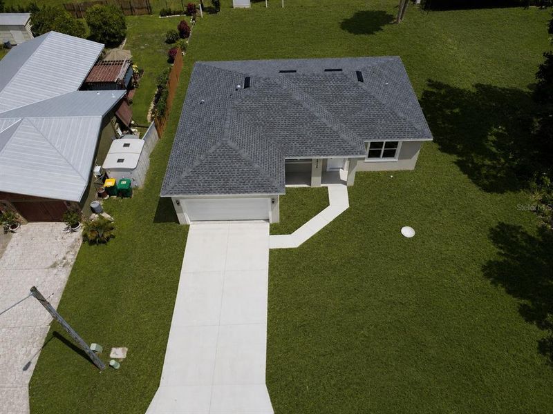Front exterior of a new home in , Port Charlotte, FL, highlighting curb appeal (Image 2). Front exterior of a new home in , Port Charlotte, FL, highlighting curb appeal (Image 2).