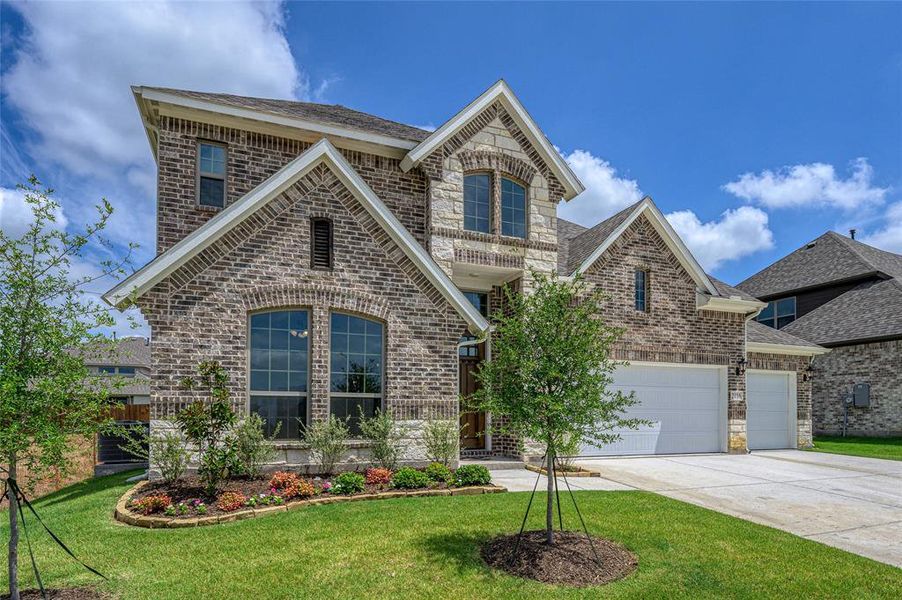 Front exterior of a new home in Stone River Glen, Royse City, TX, highlighting curb appeal (Image 2). Front exterior of a new home in Stone River Glen, Royse City, TX, highlighting curb appeal (Image 2).