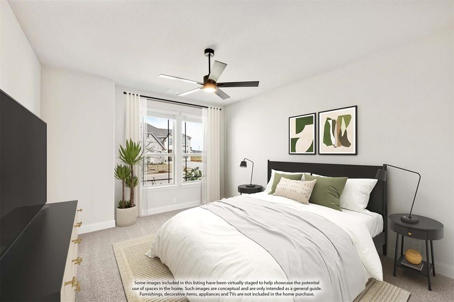 Bedroom with carpet flooring, ceiling fan, large window, and dark-framed bed with white bedding and green accent pillows Bedroom with carpet flooring, ceiling fan, large window, and dark-framed bed with white bedding and green accent pillows
