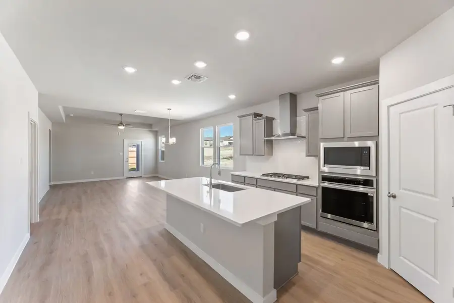 Furnished interior view inside a new home in Hunters Ranch, San Antonio (Image 4).