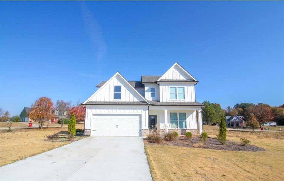 Front exterior of a new home in , Commerce, GA, highlighting curb appeal (Image 28).