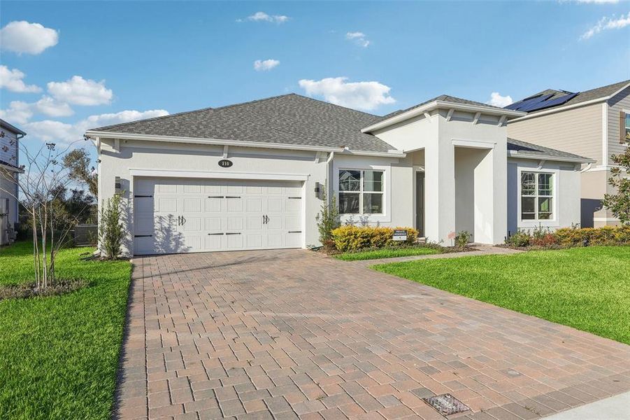 Front exterior of a new home in , Apopka, FL, highlighting curb appeal (Image 22).